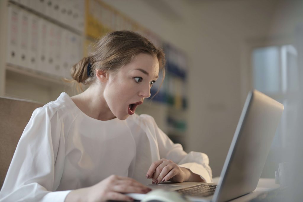 Yellow Journalism Facts - Surprised Woman Using Laptop